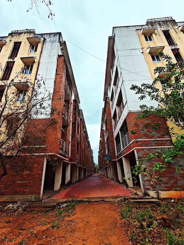Apartment blocks with brick facade, pathway between buildings